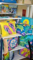 Assortment of pillowsand lampshadesand paintingsand furniture and accessories by Island Woman.jpg